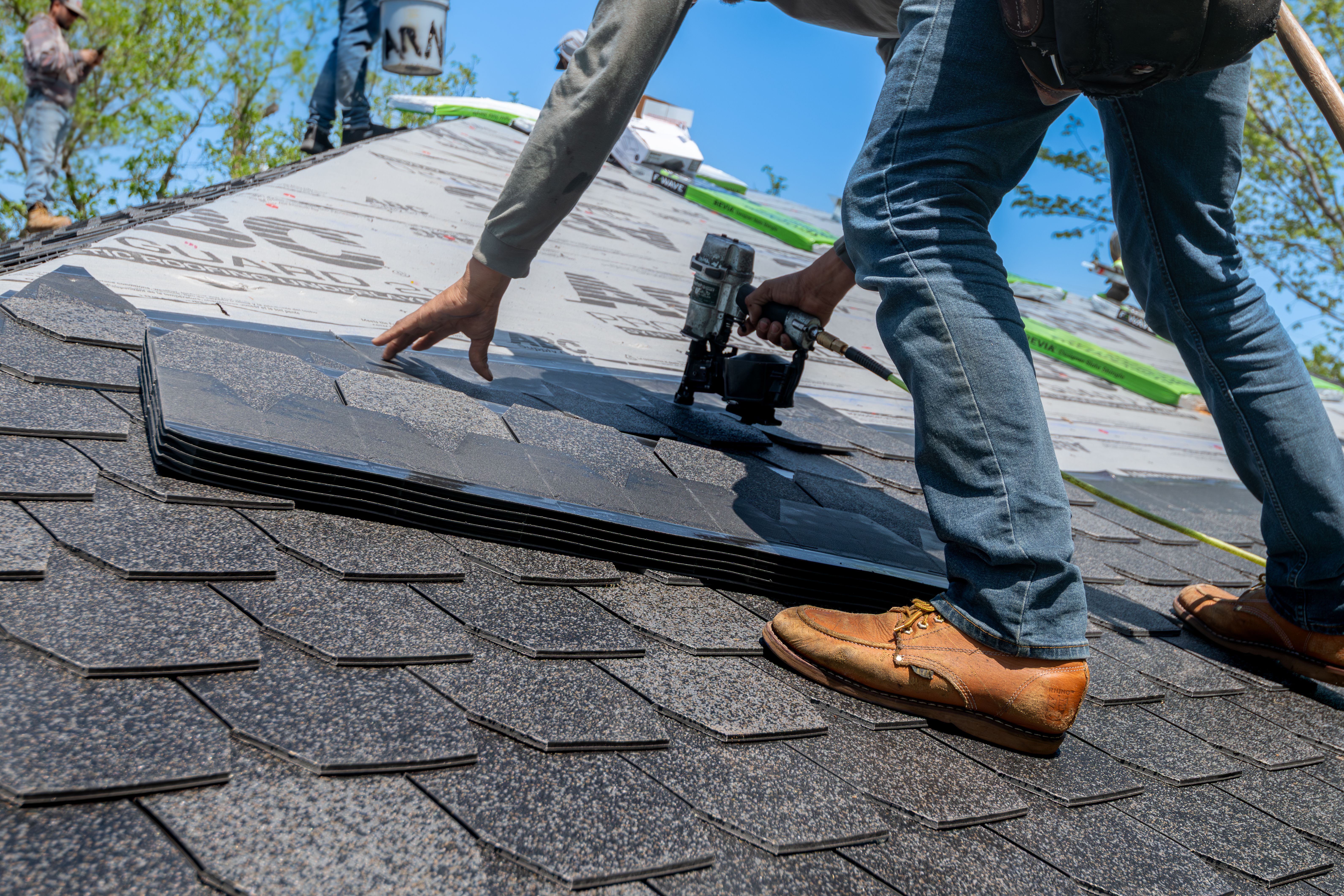 Man Stapling Roof